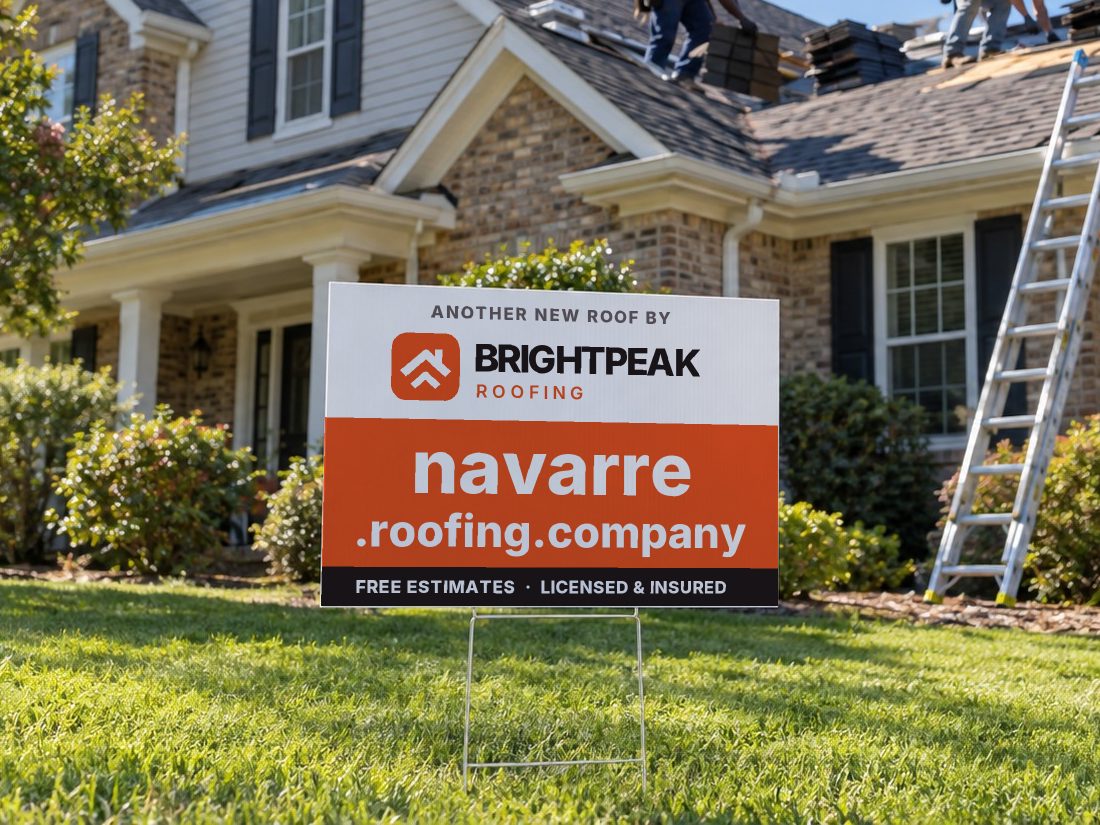 navarre.roofing.company on a yard sign in front of a house getting a new roof